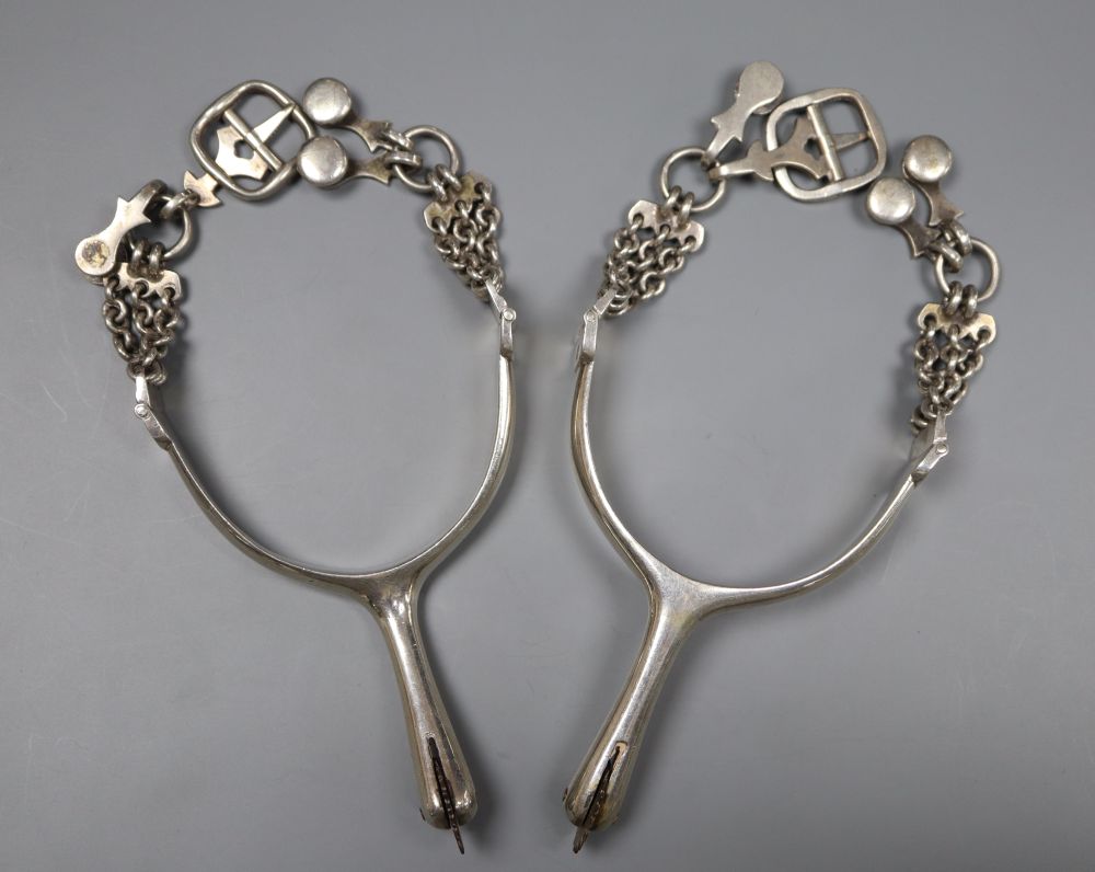 A pair of 19th century Portuguese white metal horse riding spurs, Lisbon mark, makers mark, IFF, diameter 7cm, gross 5.5oz.